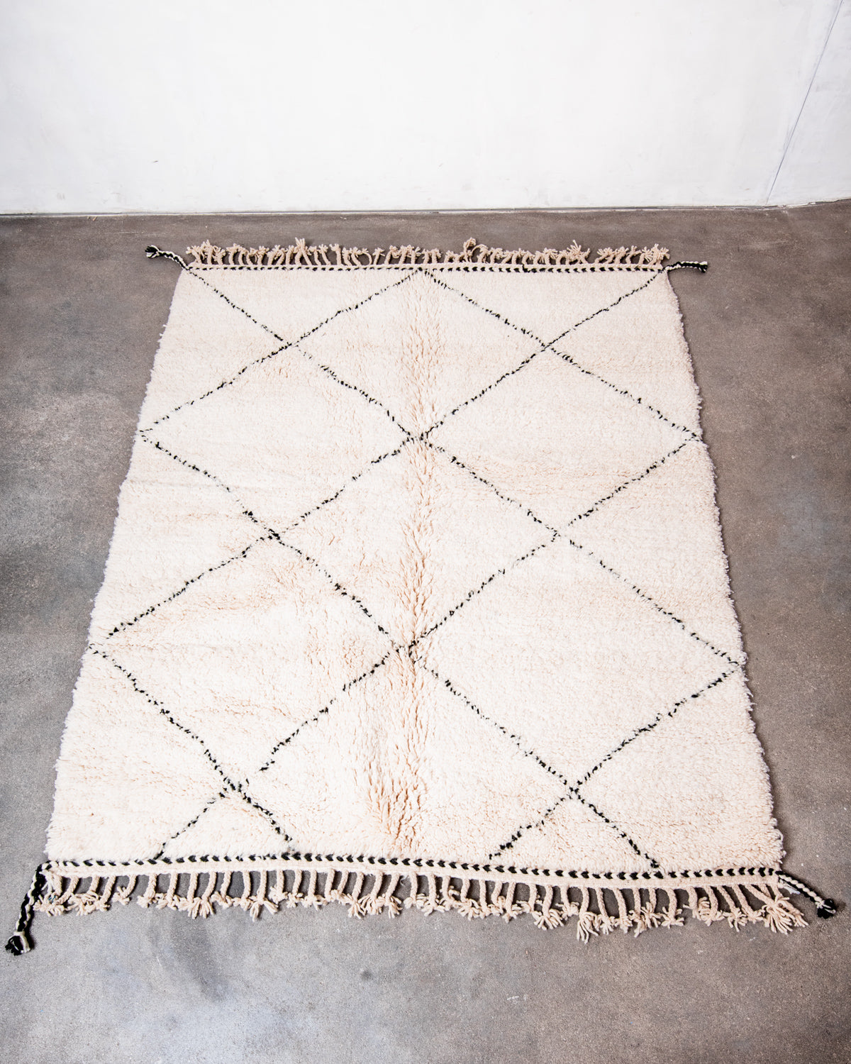Modern, designer, handcrafted Berber rug from Morocco. Beniourain carpet with minimalist design, natural wool pile and a fluffy texture.